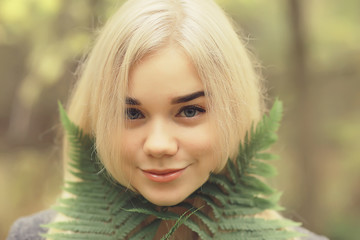 blonde nature portrait autumn, beautiful young adult girl with long hair