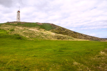 Fototapeta na wymiar lighthouse on the coast of Iceland, landmark