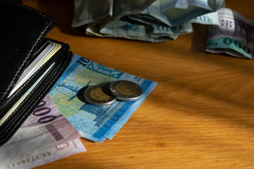 Money on wooden desk closeup