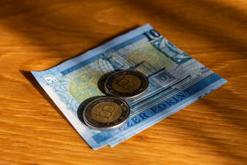 Money on wooden desk closeup