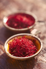 Obraz na płótnie Canvas saffron threads in vintage dishes