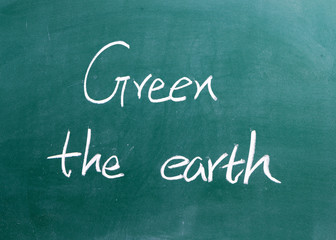word "green the earth" written on blackboard