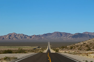 lonely road in Death Valley National Park in the USA
