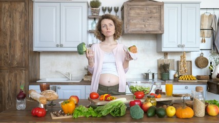 Pregnant Woman Thinking What To Eat - Burger Or Broccoli