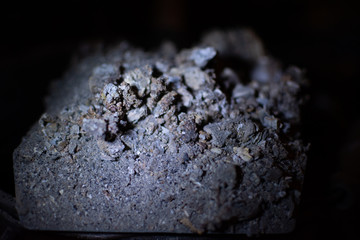 SMOG Ash from the stove on a spatula, an ecological problem