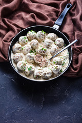 classic Swedish meatballs in a pan with spoon