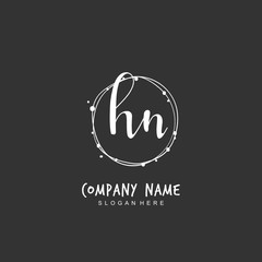 Handwritten initial letter H N HN for identity and logo. Vector logo template with handwriting and signature style.