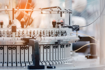 Textile Manufacturing. Circular knitted fabric. Textile factory in spinning production line and a...