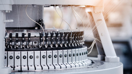 Textile Manufacturing. Circular knitted fabric. Textile factory in spinning production line and a...