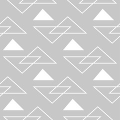 Geometric seamless background. Gray and white backdrop with triangle pattern