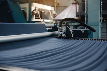 Textile Manufacturing. Circular knitted fabric. Textile factory in spinning production line and a rotating machinery and equipment production company. Clothing industry. Manufacturing textile fabrics.