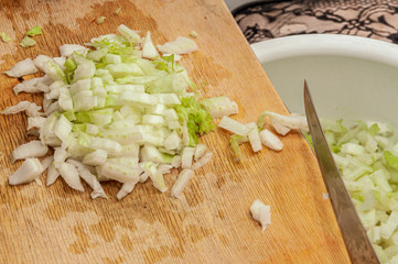 finely chopped Chinese cabbage raked from a wooden board