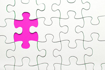 Pink puzzle piece missing, business concept