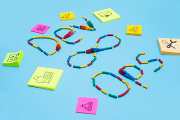 Devops concept. Developers and operations words made from cables and symbols on the blue background. Space for your text.