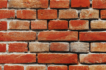 Obraz premium Wall piled of red old brick