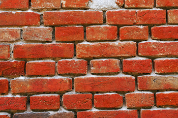 Wall piled of red old brick