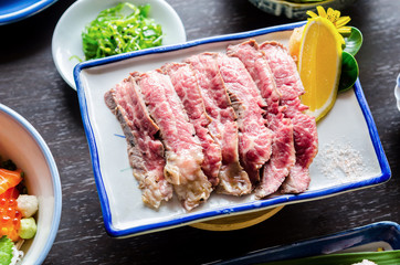 Sliced grilled Strip Loin rare degree of ripeness beef steak.