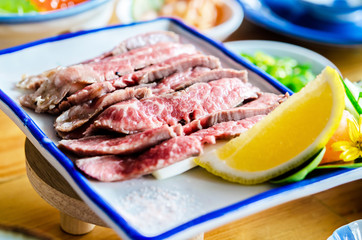 Sliced grilled Strip Loin rare degree of ripeness beef steak.