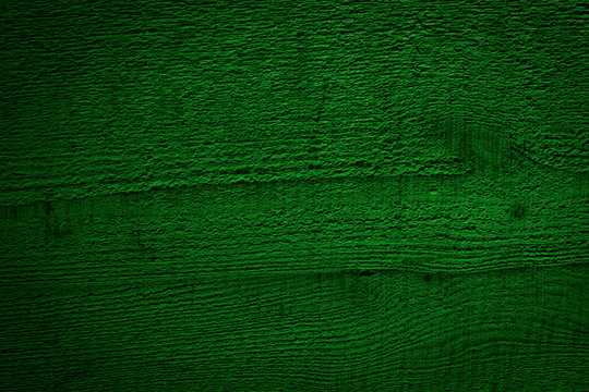 Texture of toned dark green wood. Natural pine wood background. Rough Sawn boards flat surface. Copy Space for Text, wallpaper or image.