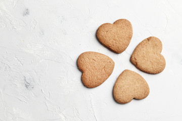 Delicious homemade cookie hearts  on a light background. Top view. Place for text.