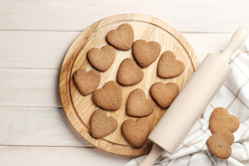 Delicious homemade hearts cookies on wooden background. Top view. Place for text.