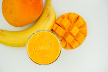 Healthy homemade milkshake. Blend fresh or frozen banana and mango and add some milk . Almold, oat or rice milk would work for vegans. No sugar added dessert. Tropical smoosthie