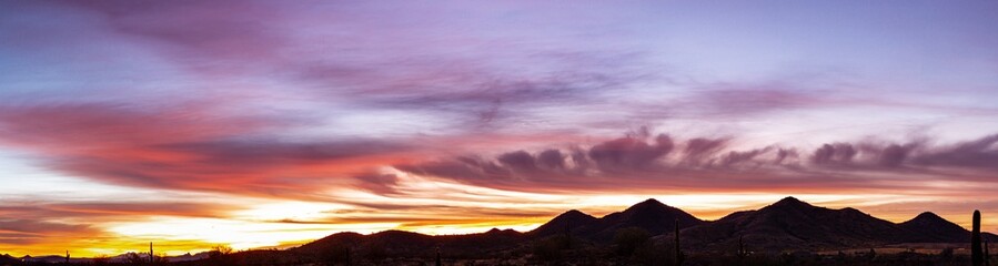 Panoramic image of a sunset over the Sonoran Desert of Arizona.