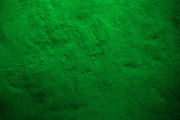 Green colored abstract wall background with textures of shades of green