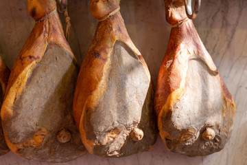 delicious pork hams hanging to mature, Tuscany