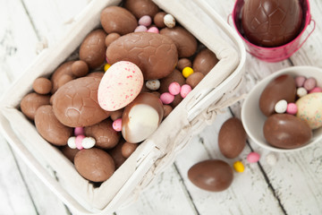 Basket of chocolate pink easter eggs 