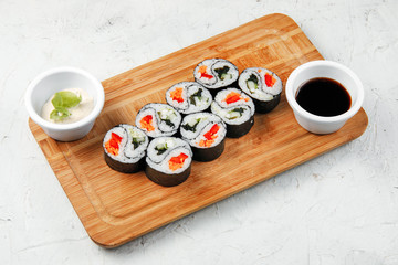 sushi rolls with rice and vegetables and crab meat