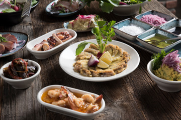 cooked fish and various appetizers
