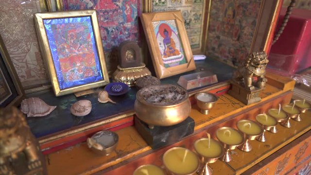 Religious shaman buddhist and tengri belief. Incense objects candle small sculpture. Tengrism are Heavenly-Father Tenger Etseg Earth Mother Eje Gazar Eej. It involves animism totemism ancestor worship