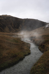 Hot river valley Rekjadalur with steamy water