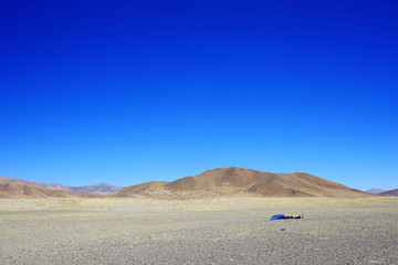 lonely man travels along deserted canyon,  desert,  lifeless terrain,  landscape of highlands