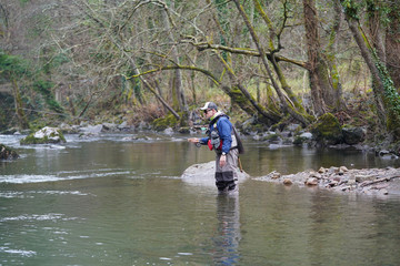 trout fly fisherman in river