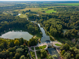 Aerial photo of a hydroelectric power station in the village of Yarolets in the Moscow region, in the frame is nature and a lake, a forest stretching into the distance.