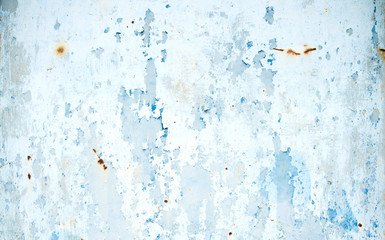 Old metallic wall with peeling blue paint