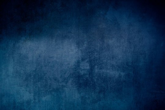 Old blue grungy backdrop or texture