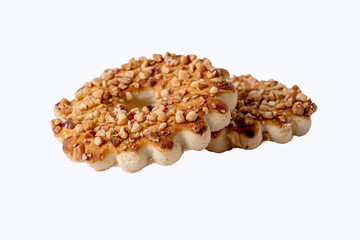 Round cookies with nuts on a white background