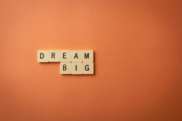 Inspirational words isolated on orange background. Wallpaper quotes.