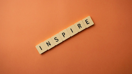 Inspirational words isolated on orange background. Wallpaper quotes.