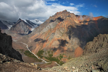 Deep mountain gorge, canyon, Altai. The river takes its source from the glaciers. Traveling in the mountains, mountaineering.