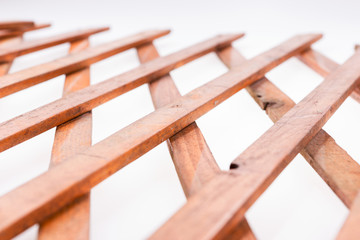 Texture of the wooden lattice isolated on white background. Natural wooden diagonal lattice. Top view