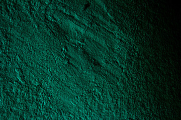 Petrol colored wall texture background with textures of different shades of petrol also called teal