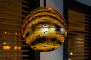 Fototapeta premium modern round lamp with golden and black lines 