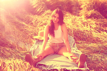 young happy european model / summer vacation, a walk in nature in the summer landscape, an adult girl alone