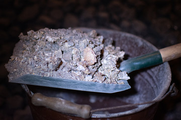 SMOG Ash from the stove on a spatula, an ecological problem