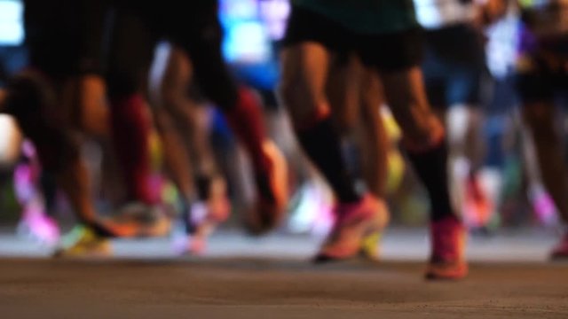 The blur moving of runners at starting point of marathon running in slow motion