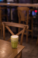 iced green tea with milk put on wooden table